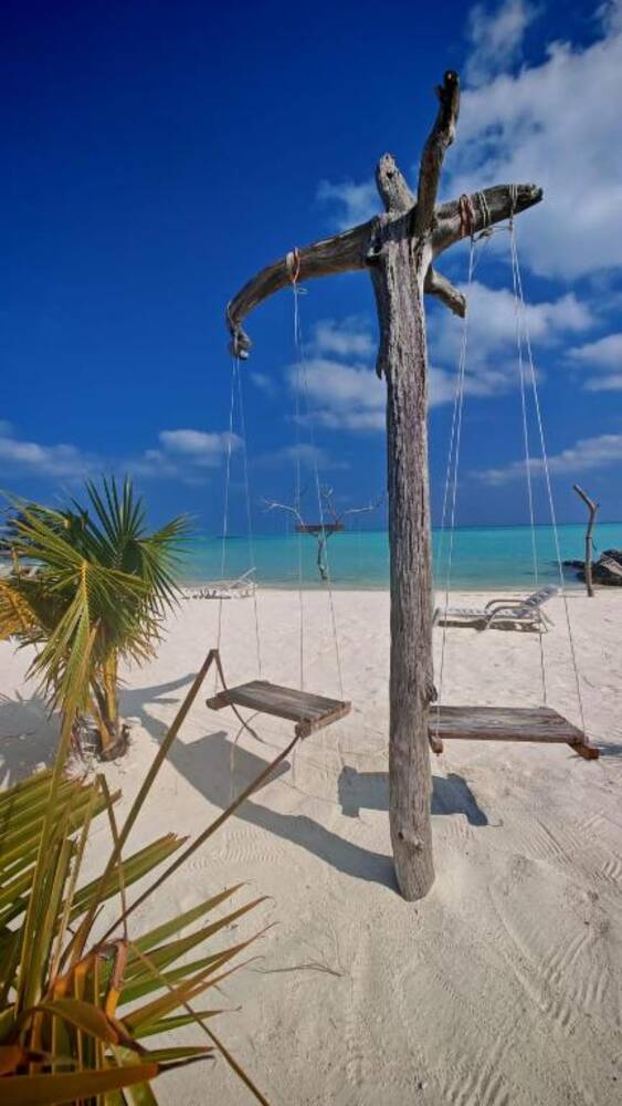 Beach swing on the white sand shore of Gaafaru island, Maldives